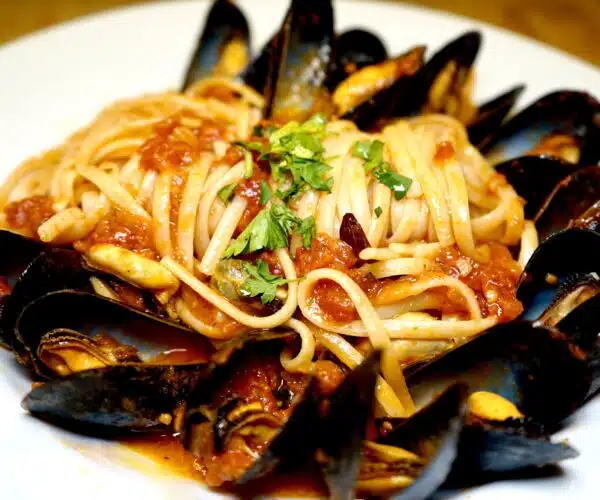 mussels linguine in red tomato sauce .Italian seafood restaurant in ft lauderdale